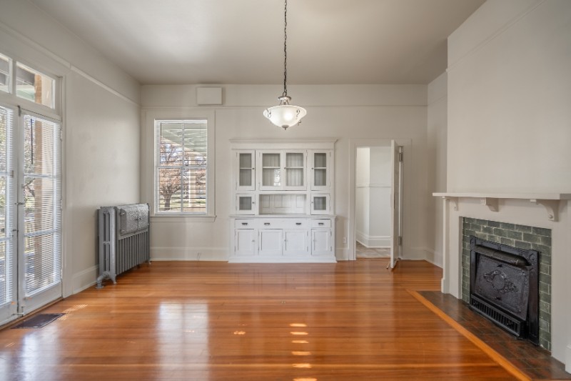 Interior living space with hardwood floors and a fireplace