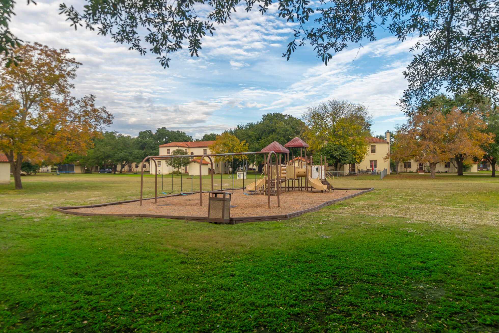 Outdoor community playground in a grassy field